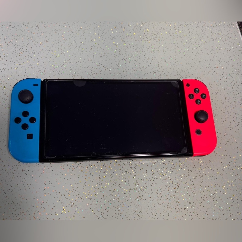 Nintendo Switch Vibrant Gaming Console with Blue and Red Controllers - Picture 2 of 7